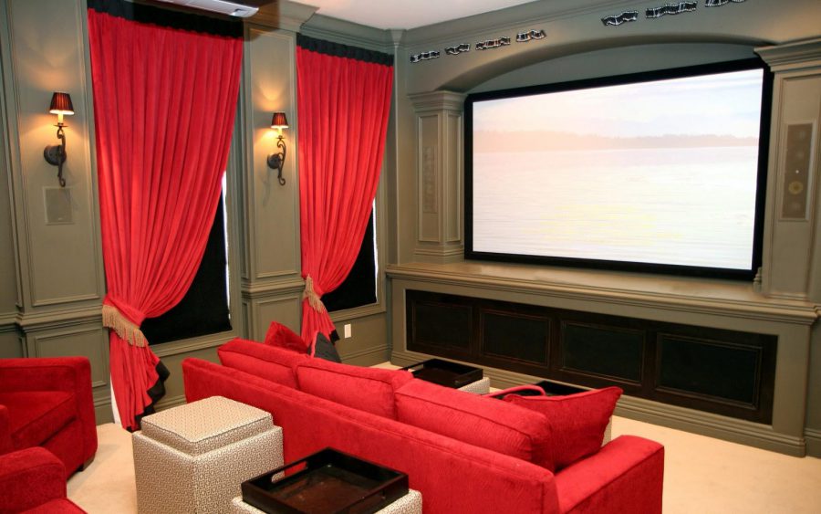 Home Theater Design With Red Sofa and Curtains