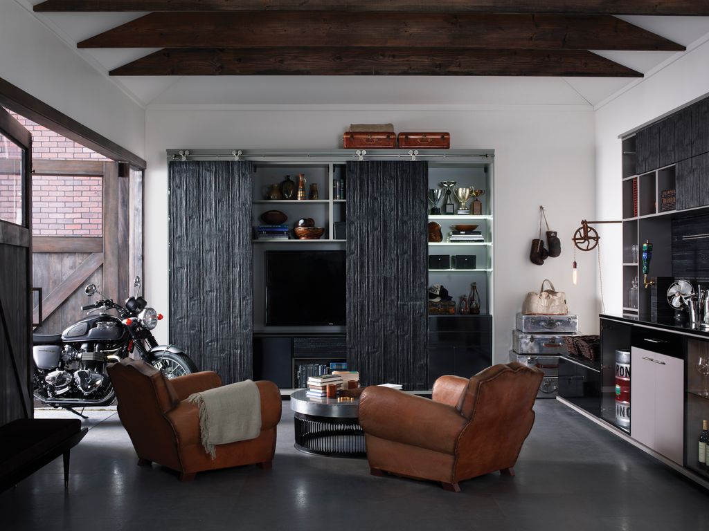 contemporary man cave with built in bookshelf