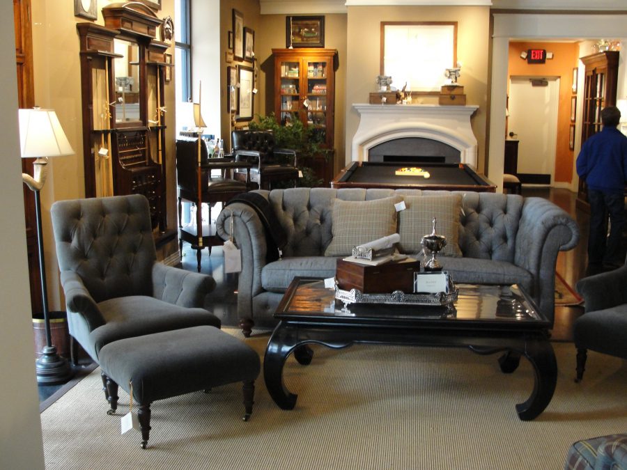 luxury man cave with grey tufted wing chairs and table