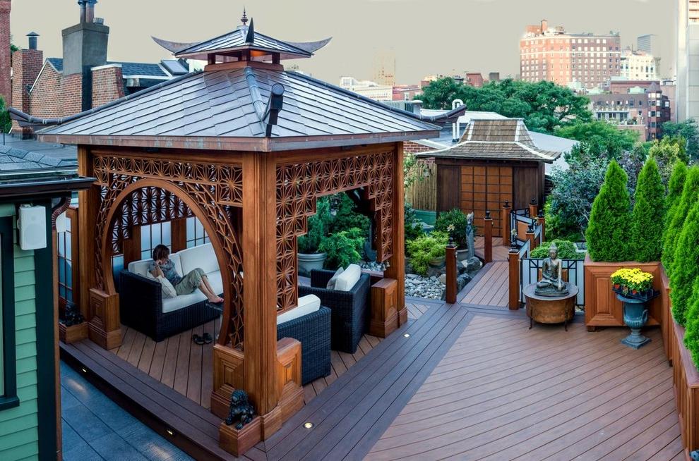 Gazebo in oriental style on the roof of the high-rise building