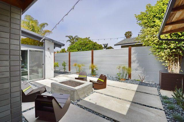 A beautiful country plot with a fence made from corrugated board