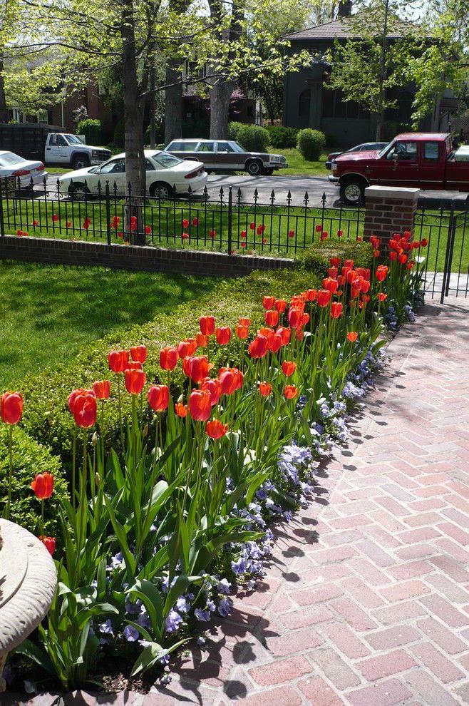 Decorative fence with base and pillars of clinker bricks