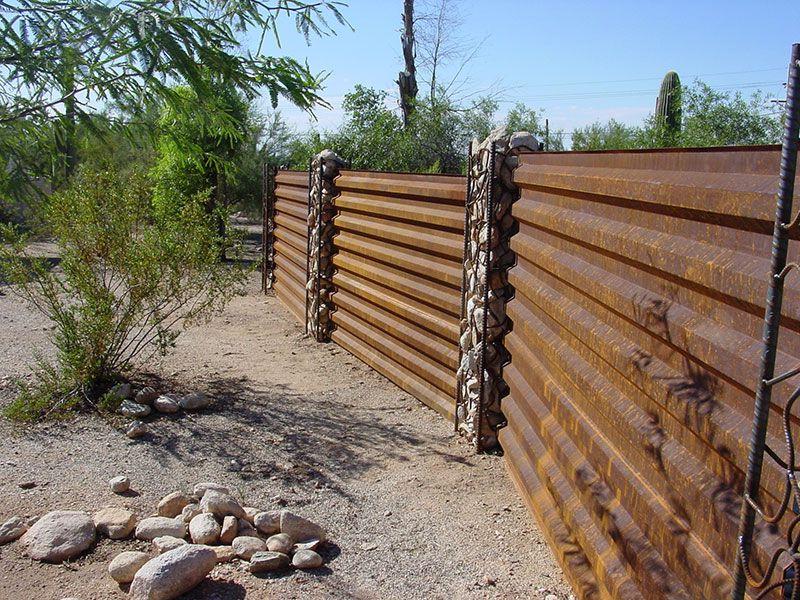 Fence made of profiled sheet in rustic style