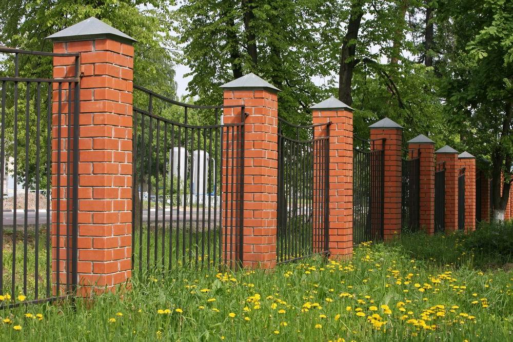 Fence with poles made of ceramic bricks