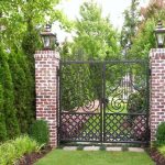 Forged gates perfectly combined with brick wall