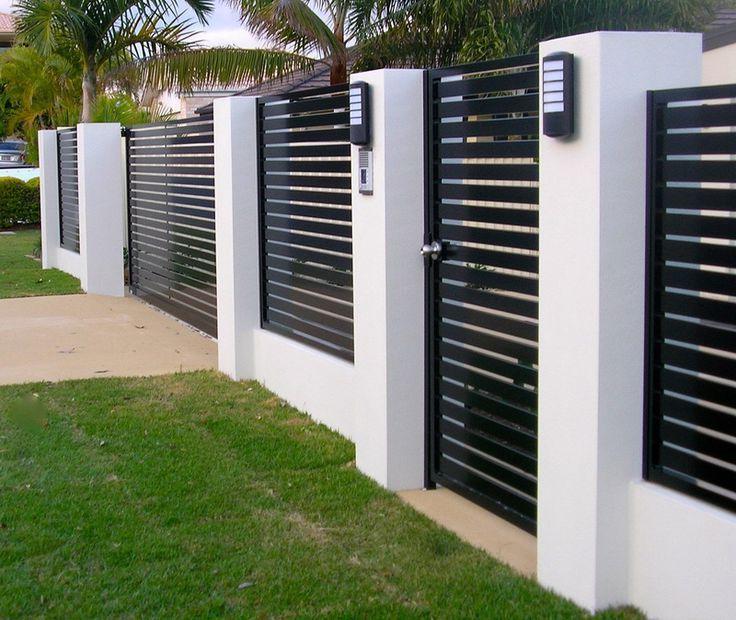 Modern metal fence with contrasting concrete pillars