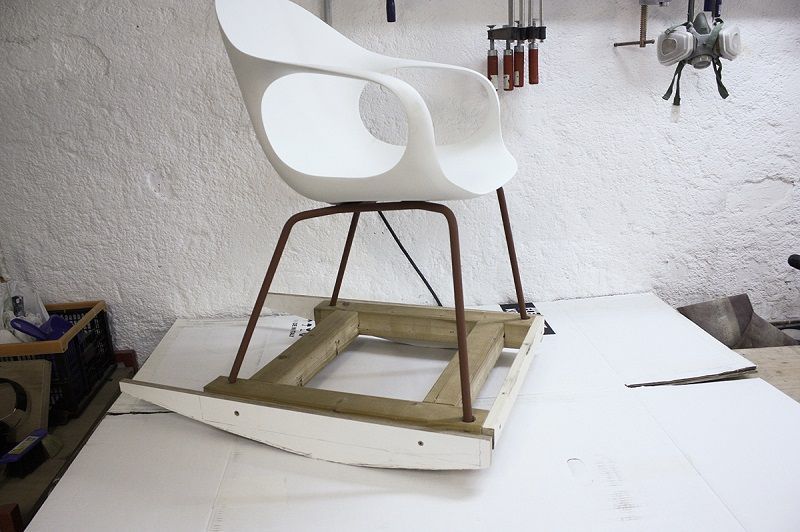 A sample of a rocking chair from an ordinary chair and makeshift skids