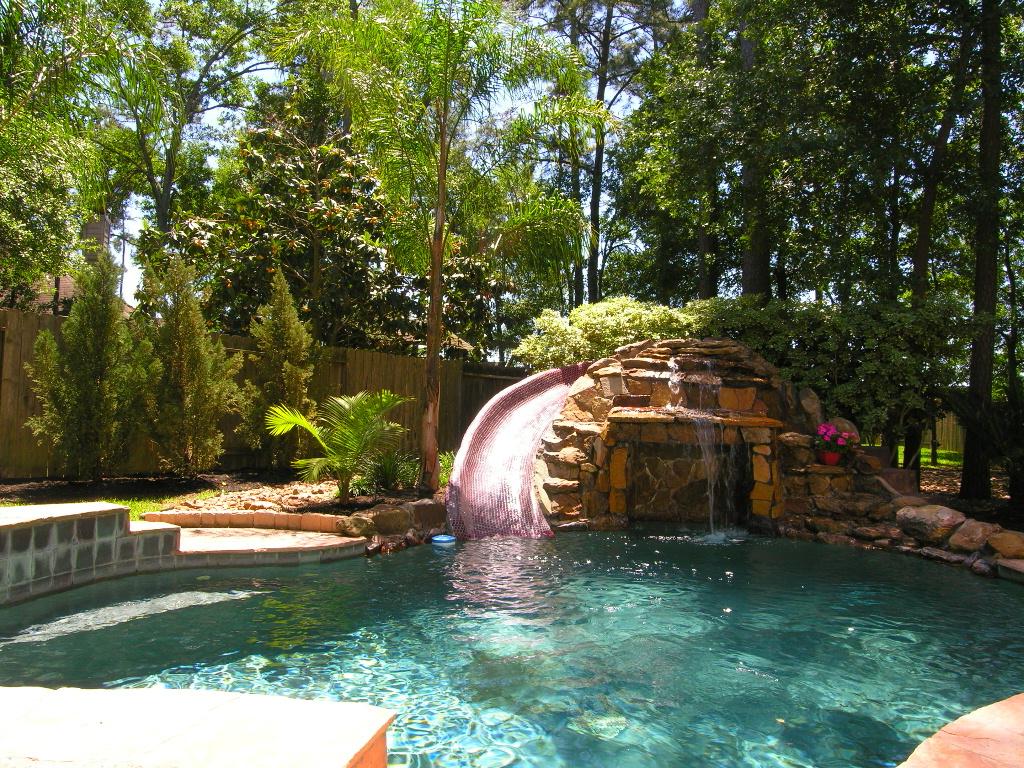 backyard pool design with waterfall slides