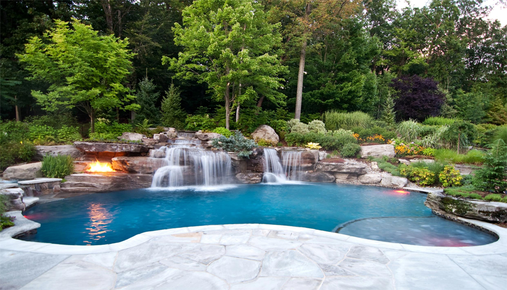 backyard pool with fire pit