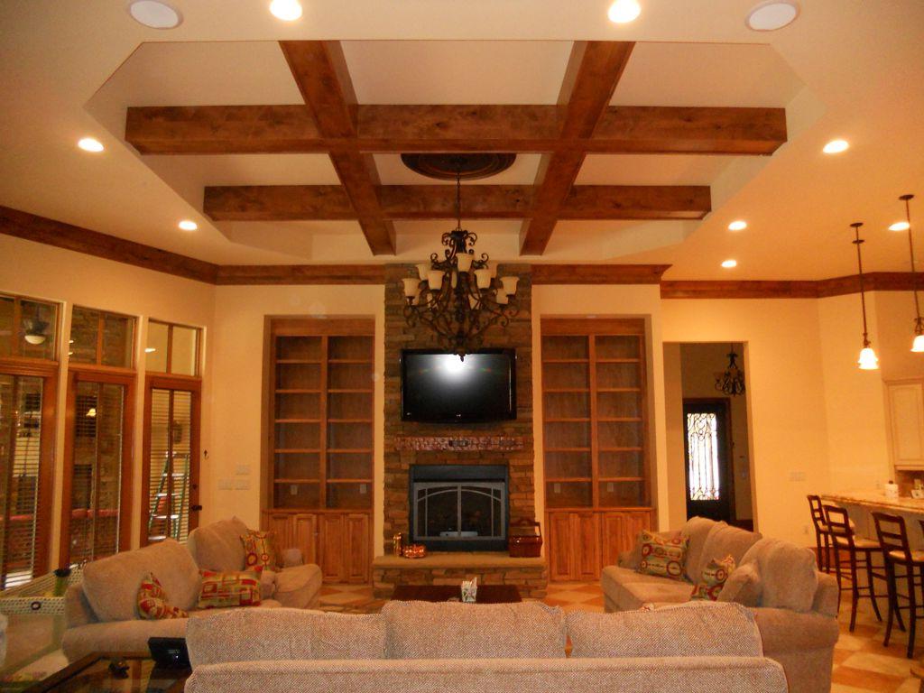 Stunning wooden beam ceiling design for living room feat black iron hanging lamp