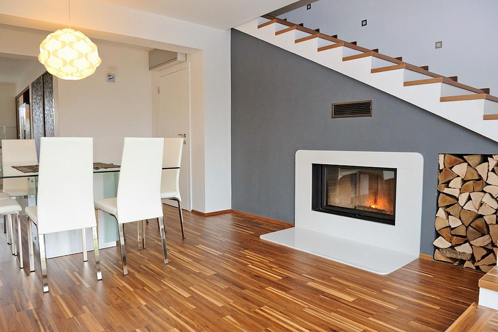 fireplace or stove under staircase