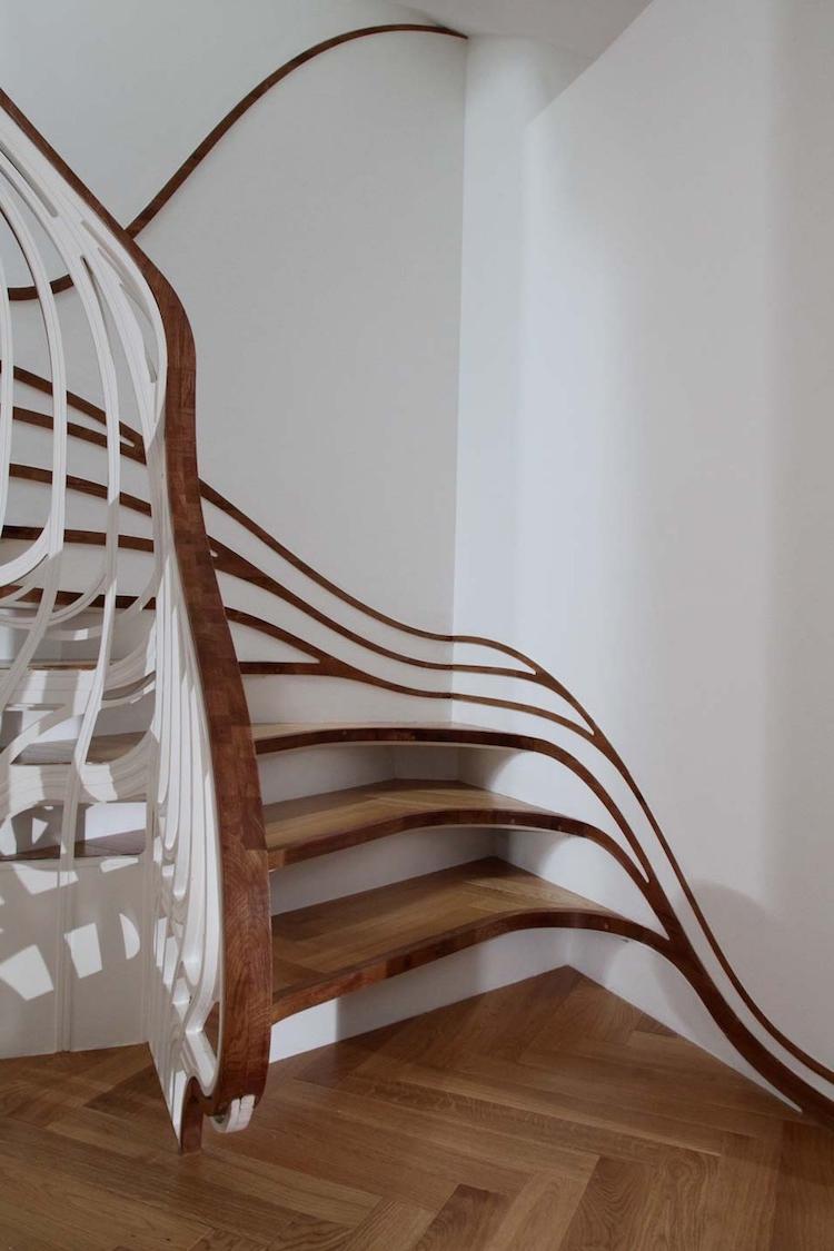 spiral staircases with curved brass-leaf fences