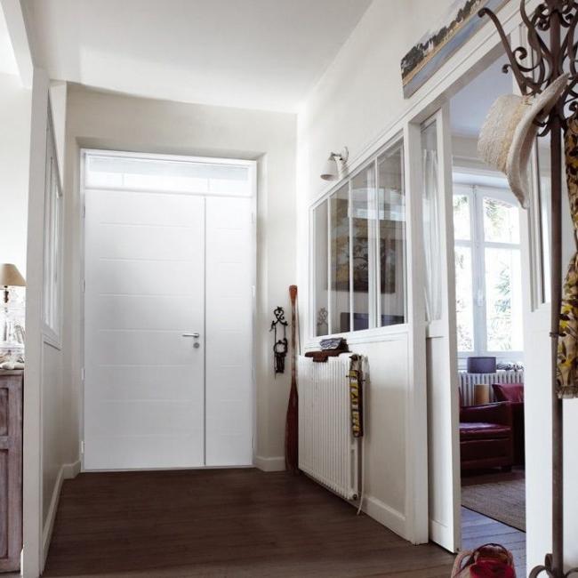 Cozy apartment with white metal door