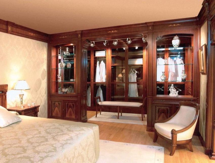 A dressing room is equipped along one of the bedroom walls.