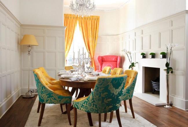 Bright curtains and massive chairs in the dining room