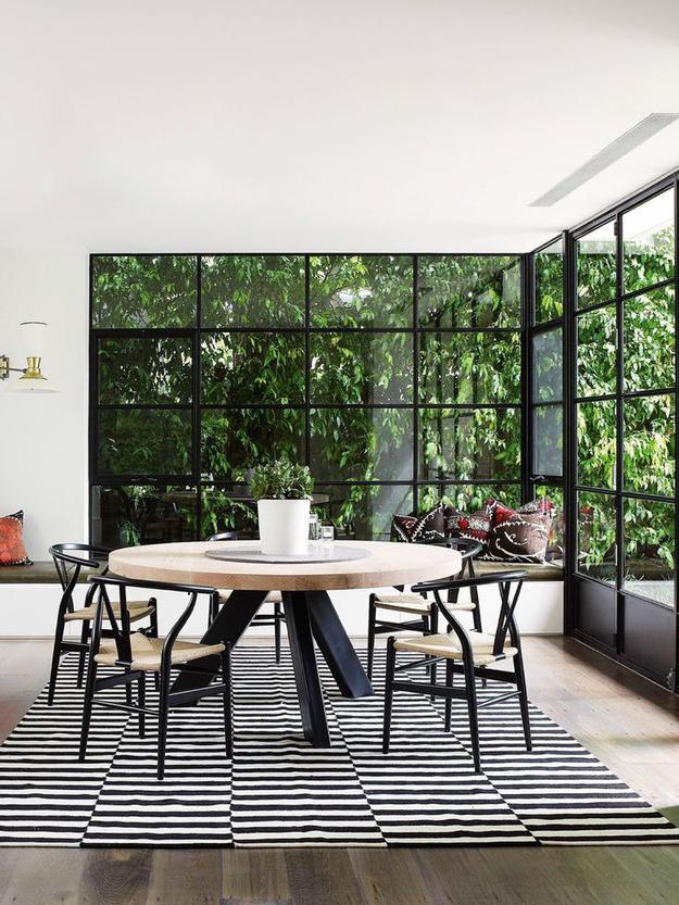 Dining area in a private house with large windows