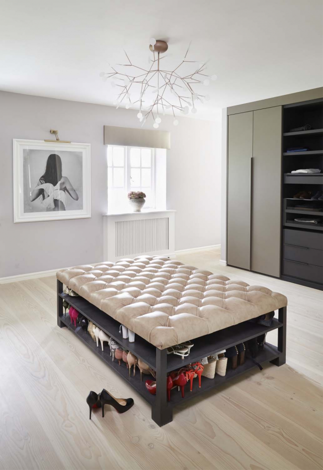 Modern dressing room with a large pouf in the center