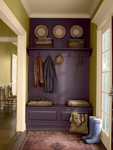 a small entrance hall with a closet for shoes with a comfortable seat