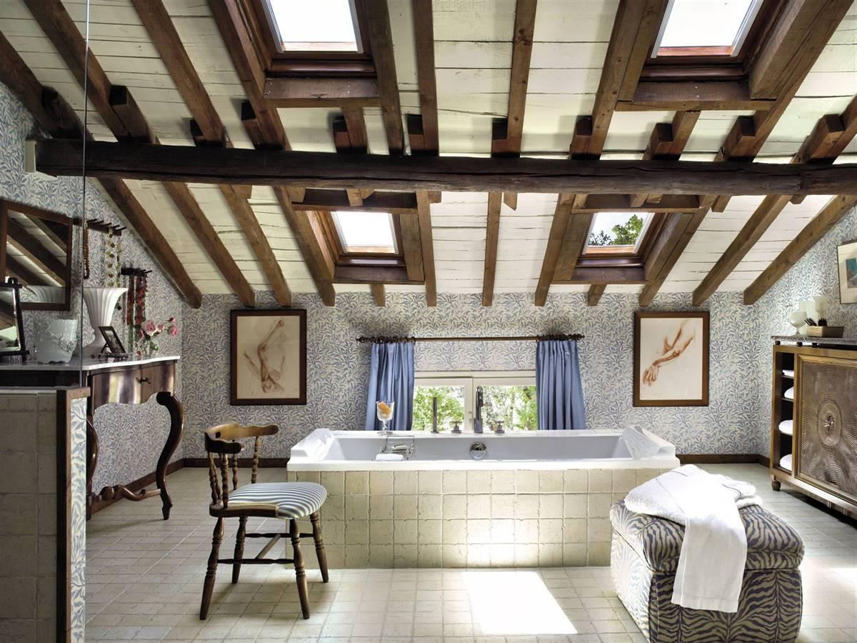 A RUSTIC BATHROOM WITH A FREESTANDING BATHTUB