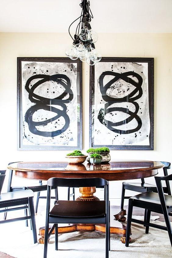 Wooden oval table in the interior of the kitchen