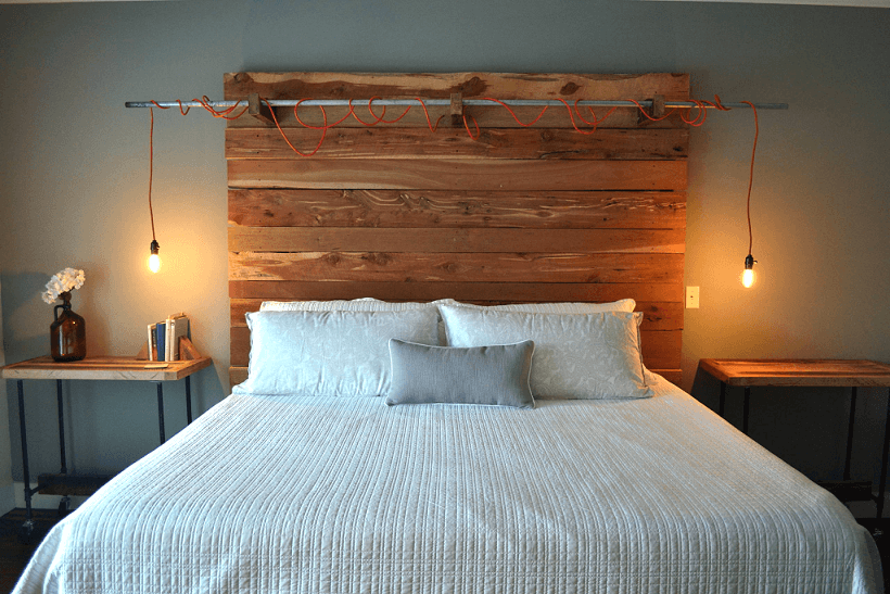 Unusual lamp mounted on the wooden headboard