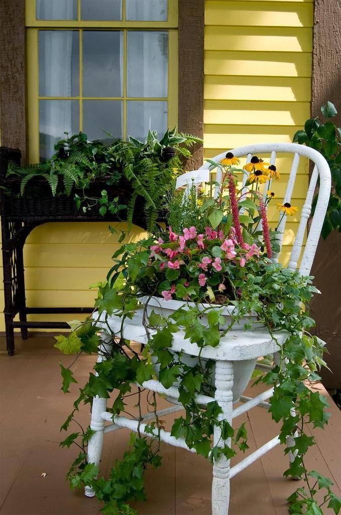 An old chair can be a great base for creating a floral arrangement.