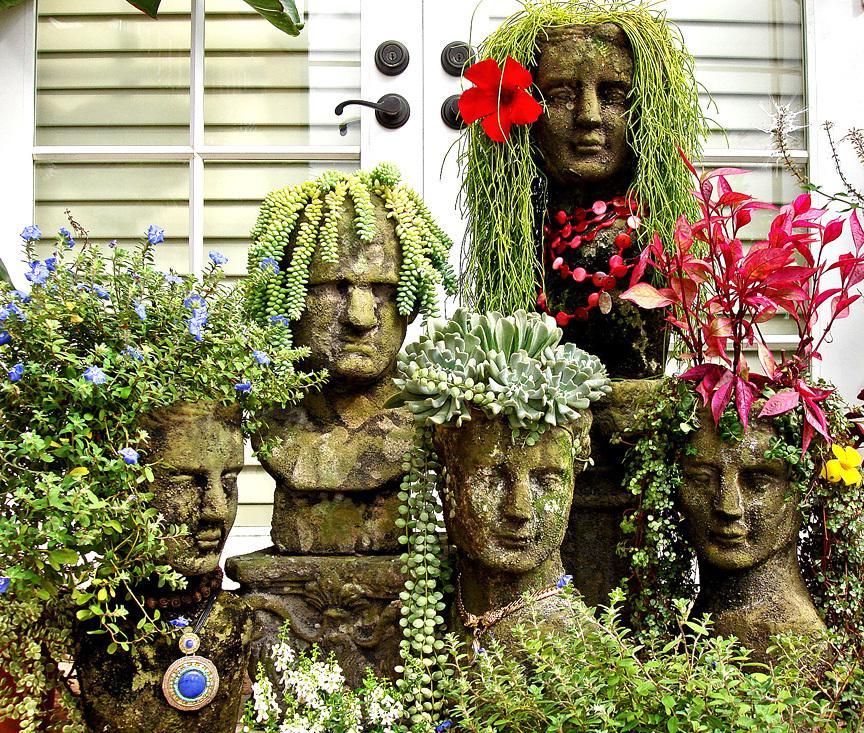 Funny pots in the form of concrete busts with plants-hairstyles will not leave you indifferent