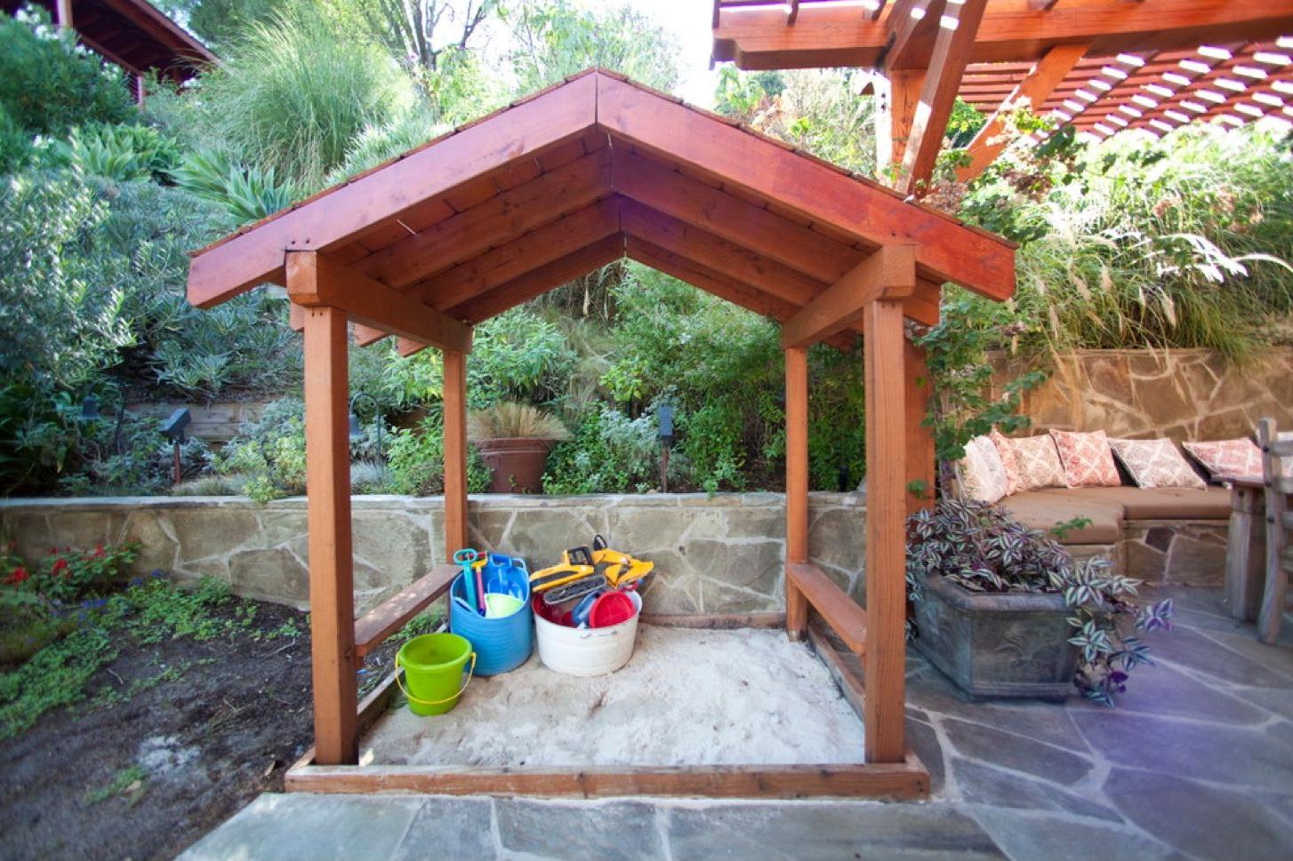 Sandbox with a wooden shed