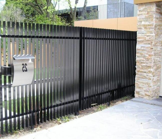 Black metal picket fence