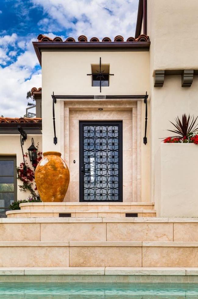 Chic metal door with glass and wrought iron elements