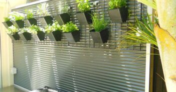25 Corrugated Metal Fences: Uplifting Everyday Materials Fence decoration with flowerpots with live plants