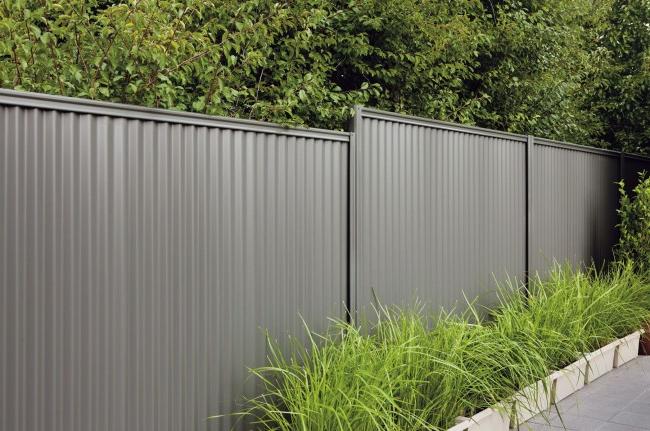 Fence made of beautiful gray profiled metal