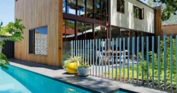 30 Metal Picket Fences to Make Your Home One to Watch Ideal for separating pool and lawn
