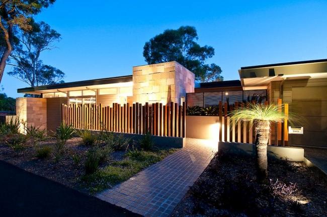 Metal picket fence in front of the house