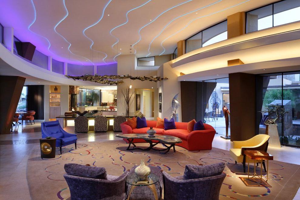 With the help of LED strips, you can clearly highlight the contours of a multi-level ceiling