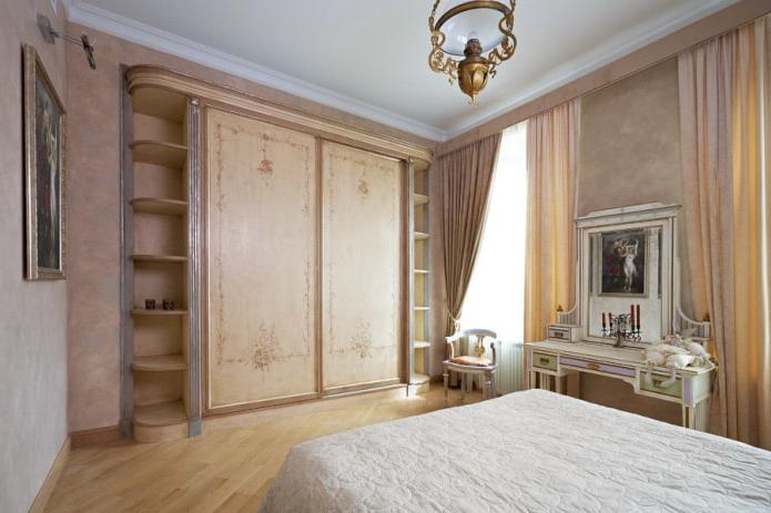 traditional-style bedroom with a wooden wardrobe fitted with side shelves.