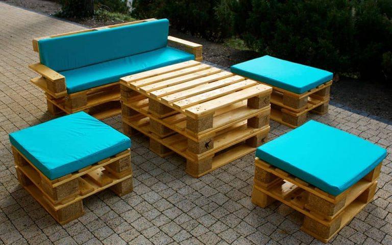 Decorating wooden pallets with colorful pillows will refresh their boring design