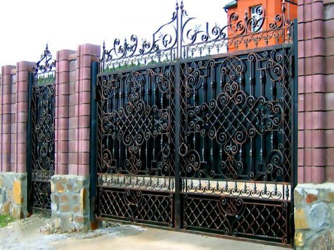 Magnificent wrought-iron swing gates with a wicket