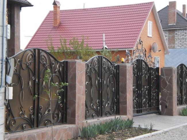 Swing gates and wickets with a wrought-iron pattern