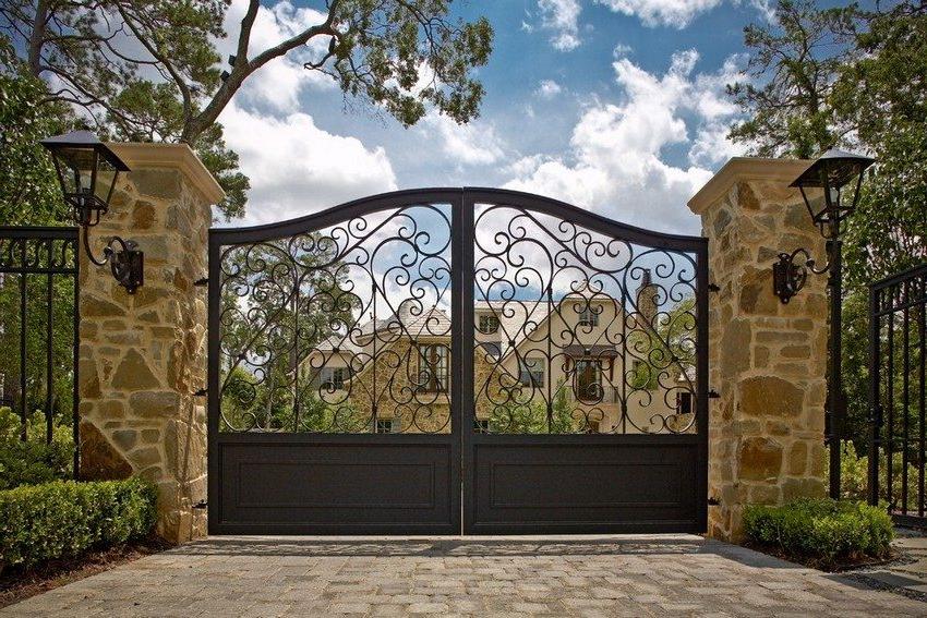 Wrought iron gates and wickets look elegant and luxurious