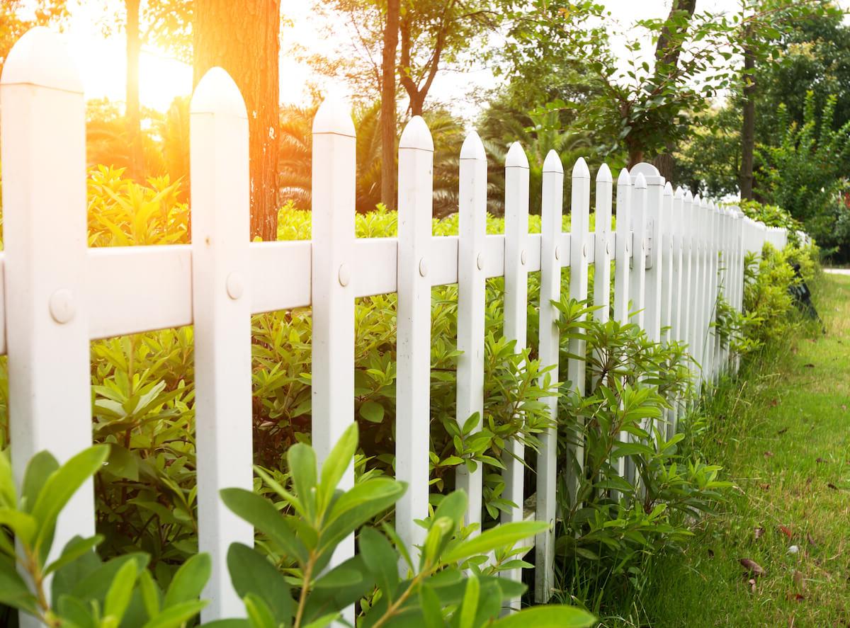 white wooden picket fence